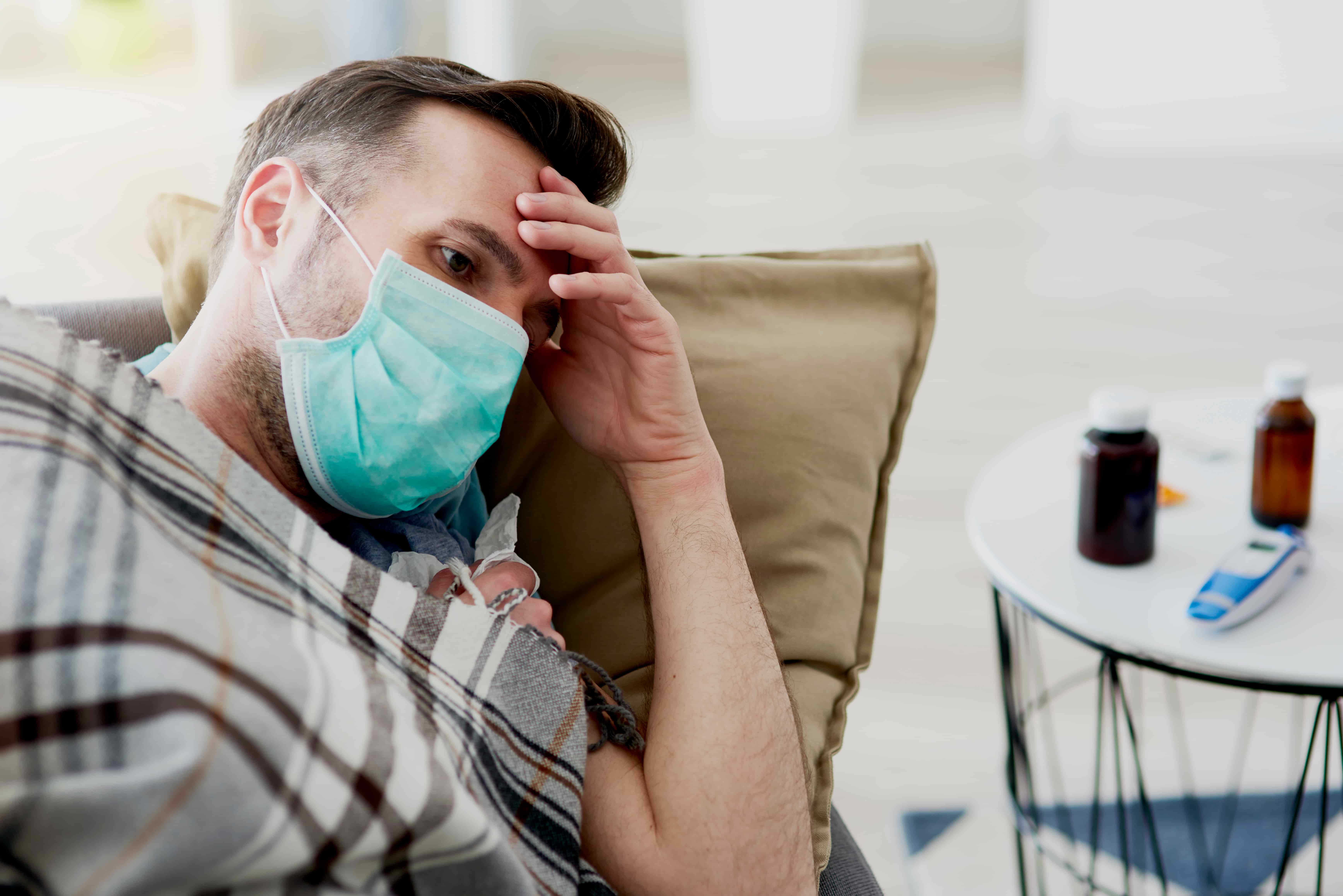 Man in Japan wearing a face mask to prevent flu infection