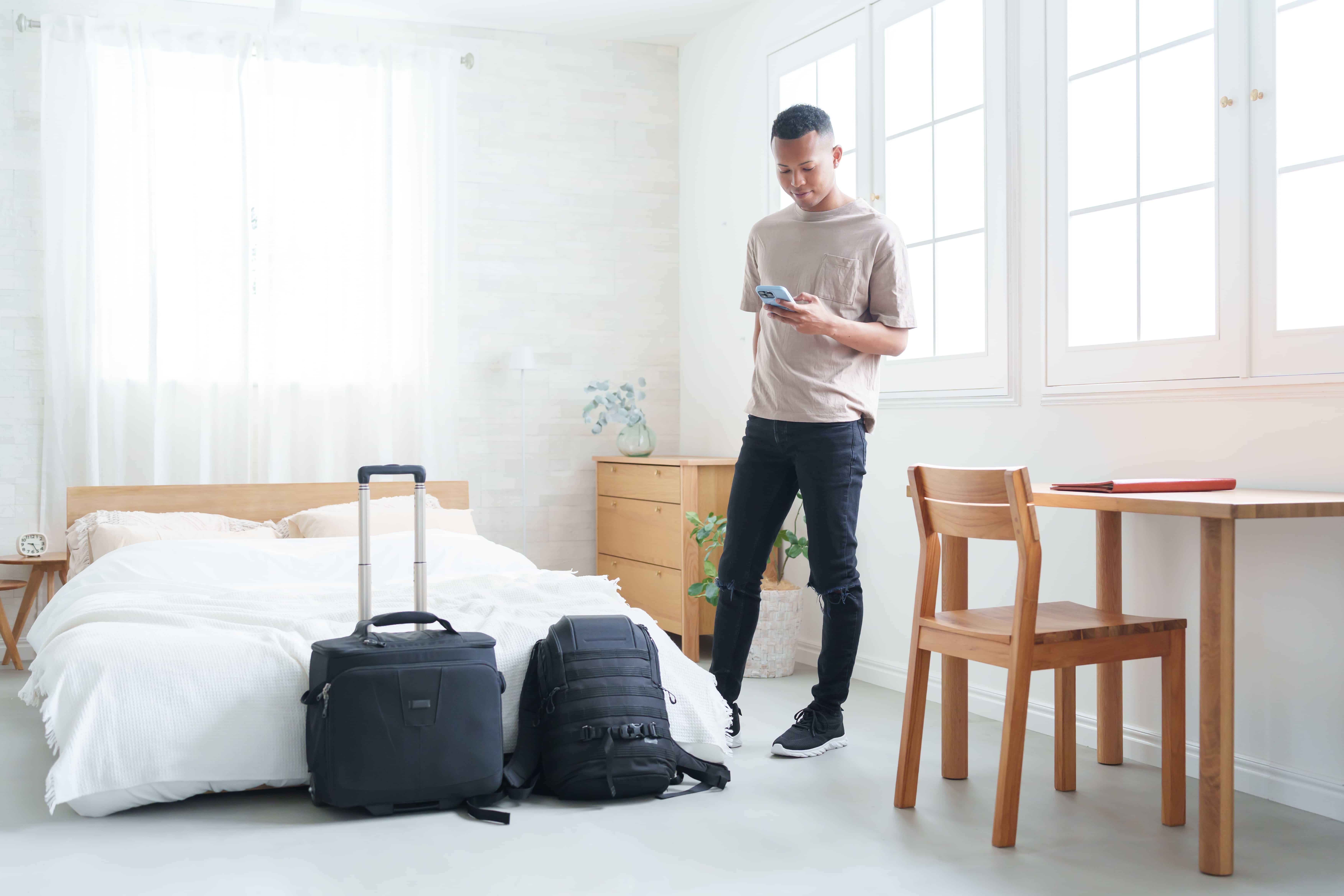 Man preparing for travel with planning documents