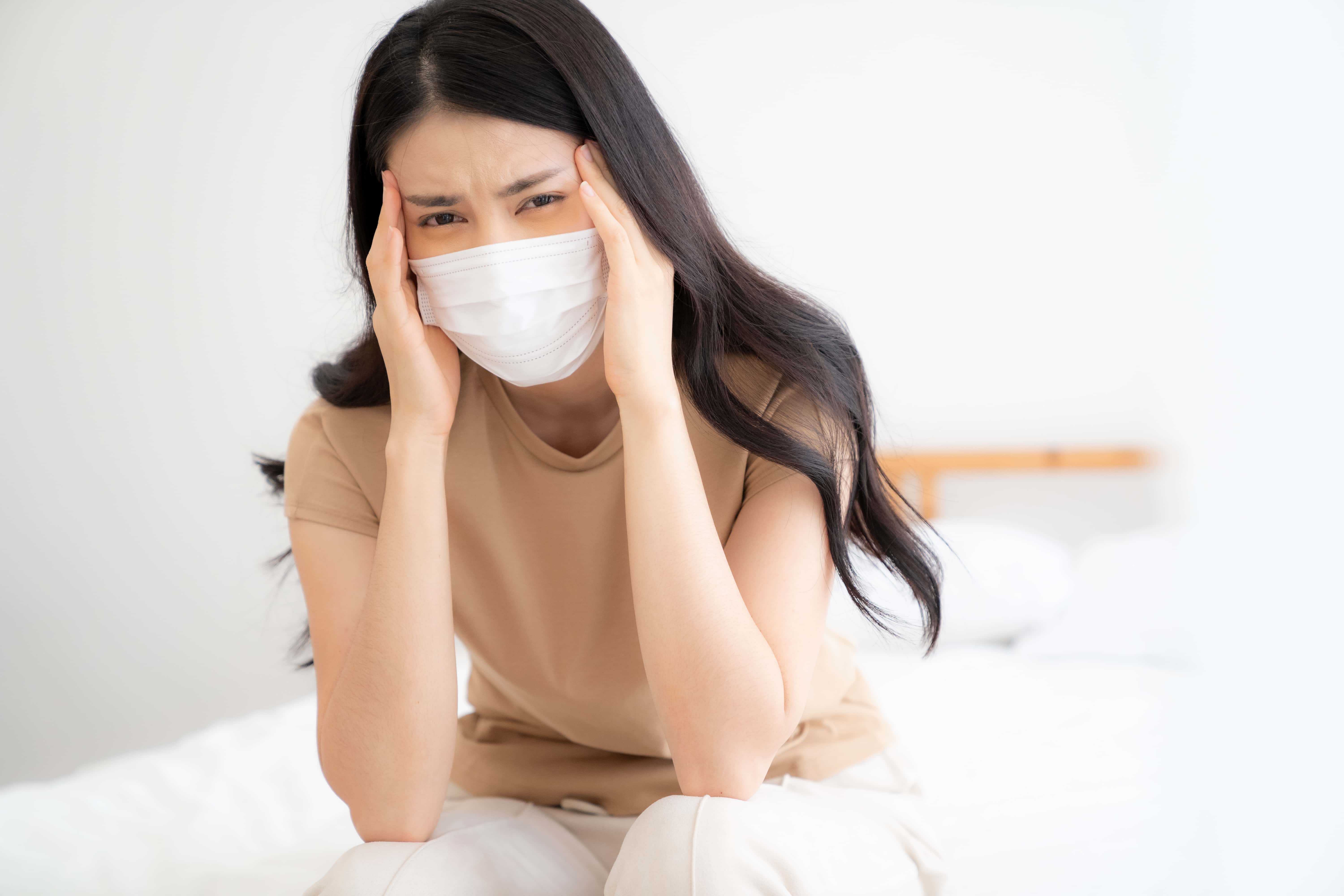 Sick woman feeling unwell and in need of medical attention